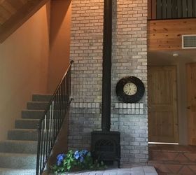 q any decorating ideas for this tall brick fireplace