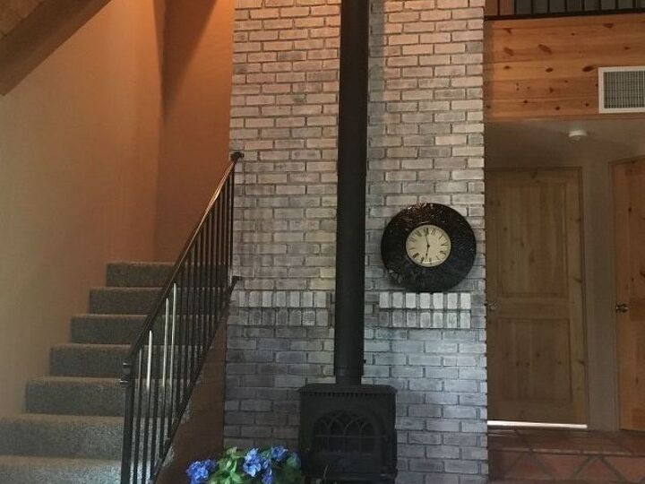 q any decorating ideas for this tall brick fireplace