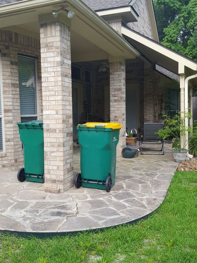 q how do i disguise 2 trash cans that are visible from seating area