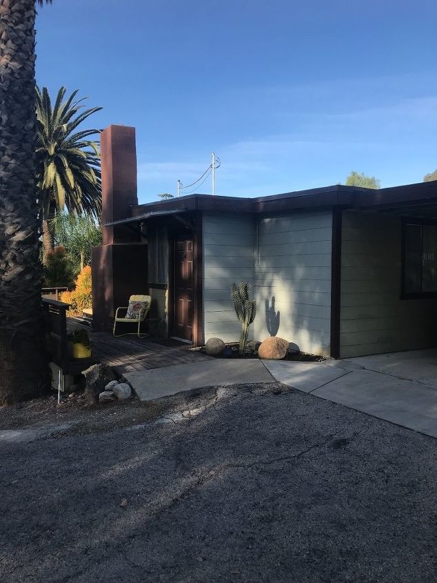 modern ranch black house wood trim