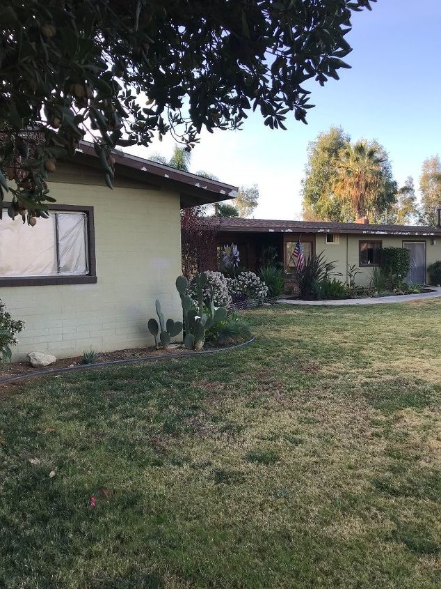 modern ranch black house wood trim