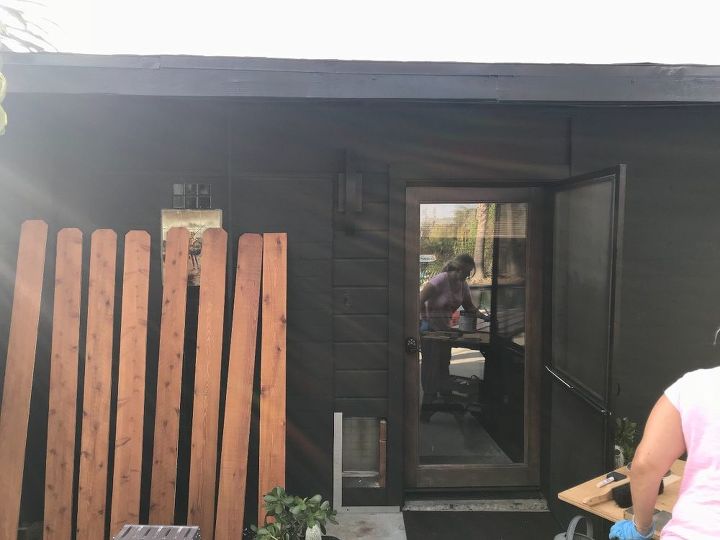 modern ranch black house wood trim