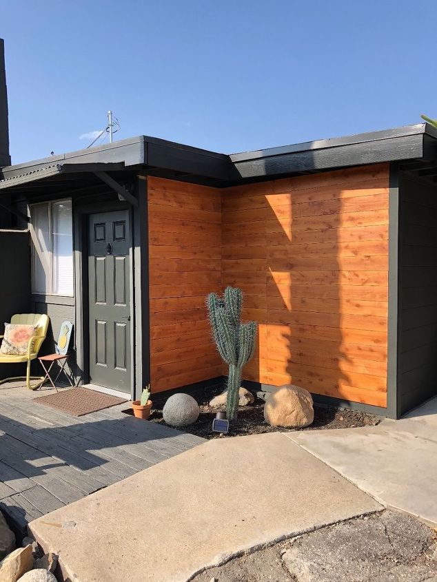 modern ranch black house wood trim