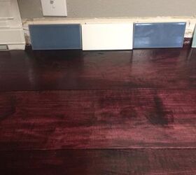 q which color backsplash looks best with this black cherry counter top
