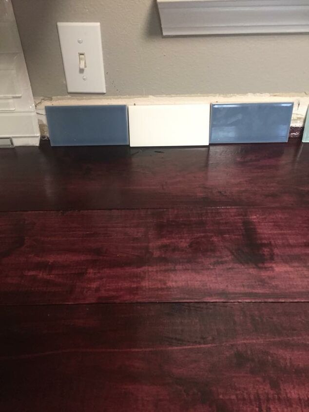 q which color backsplash looks best with this black cherry counter top