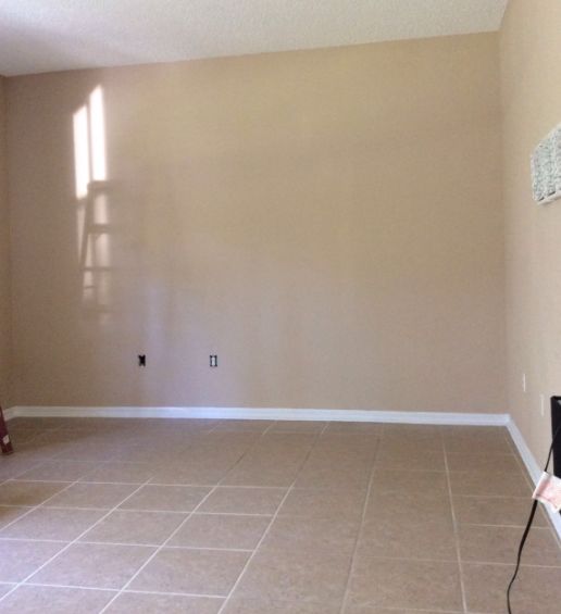 faux cement wall and floating cabinet