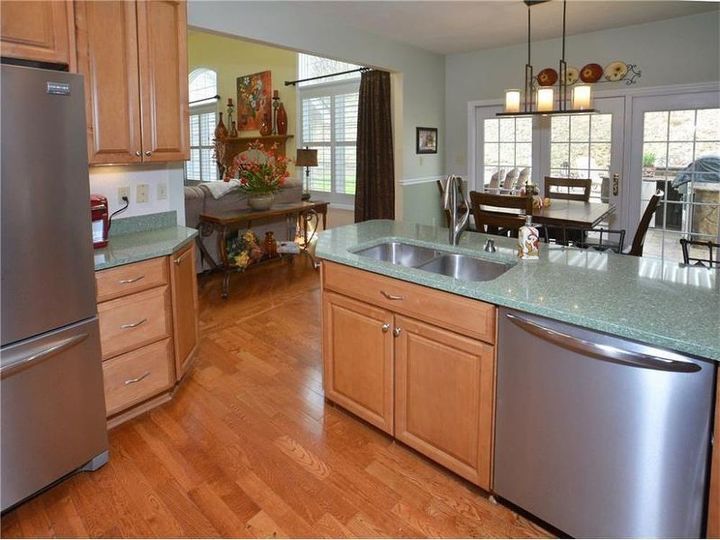 how do i learn to love the green quartz countertops in new house