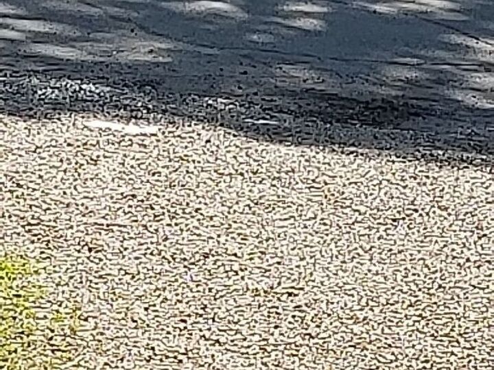 q how to keep my rock driveway from going into the road