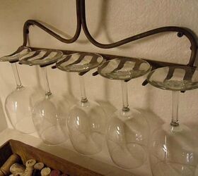 s 15 ways to recycle and create more storage at the same time, Use an old rake as a wineglass rack