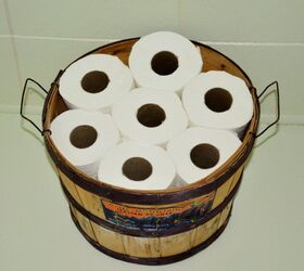 s 15 ways to recycle and create more storage at the same time, Use a fruit basket as toilet paper storage