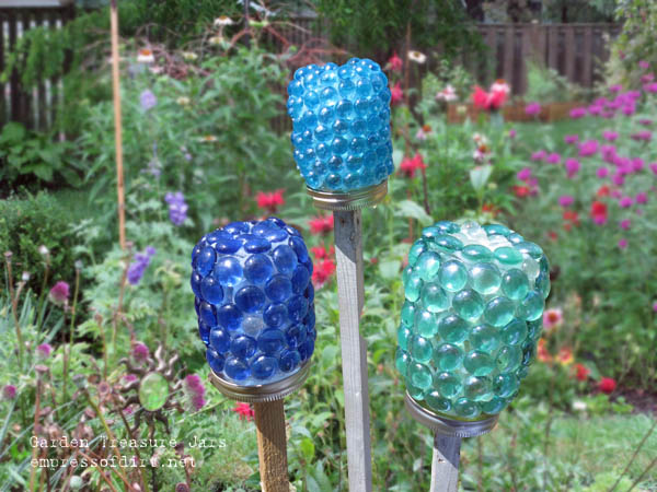15 amazing things you can make with dollar store gems, Make pretty garden treasure jars