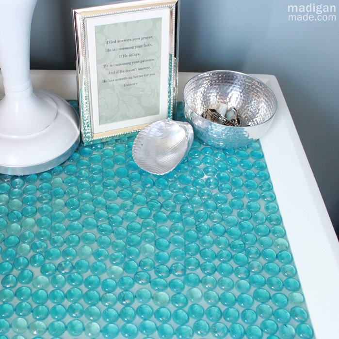 15 amazing things you can make with dollar store gems, Add them to a plain piece of furniture