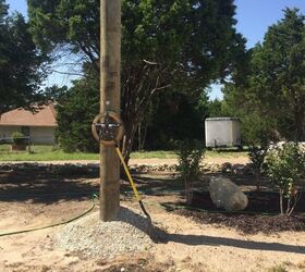 How can I make an electric pole “go away” in my landscaping?