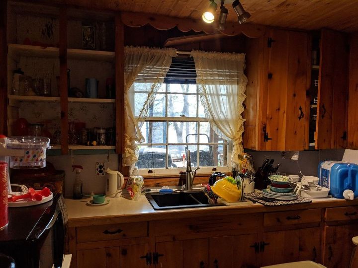 q these are my dark knotty pine kitchen cabinets at our cottage