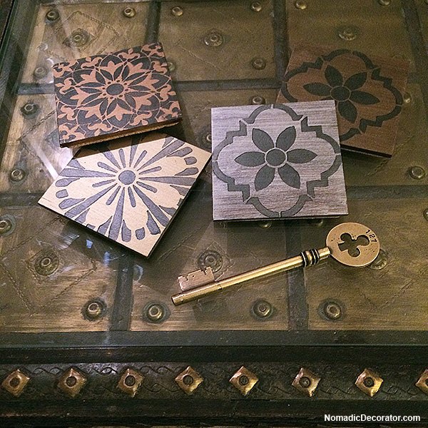 s 30 stunning ways to use metallic paint no experience necessary, Design Dramatic Lustrous Stenciled Coasters