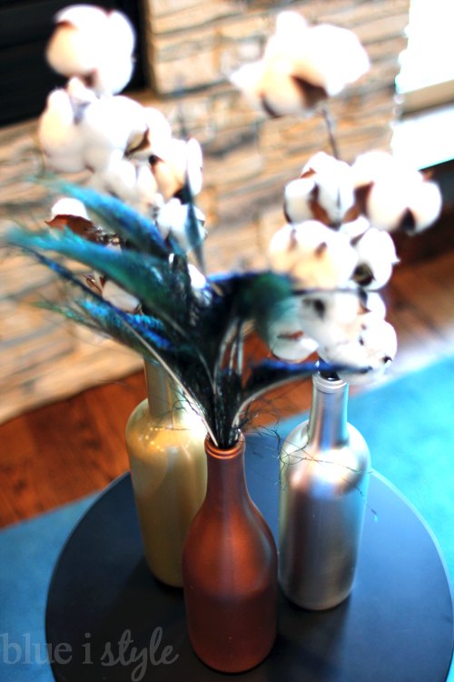s 30 stunning ways to use metallic paint no experience necessary, Make Wine Bottles Into Table Decor With Paint