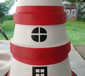 terra cotta pot lighthouse with solar light