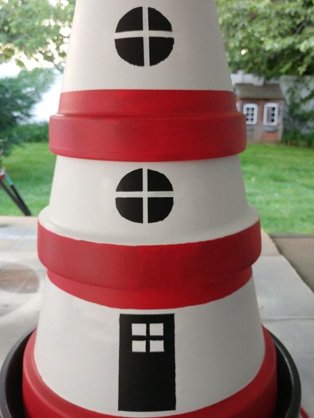 terra cotta pot lighthouse with solar light