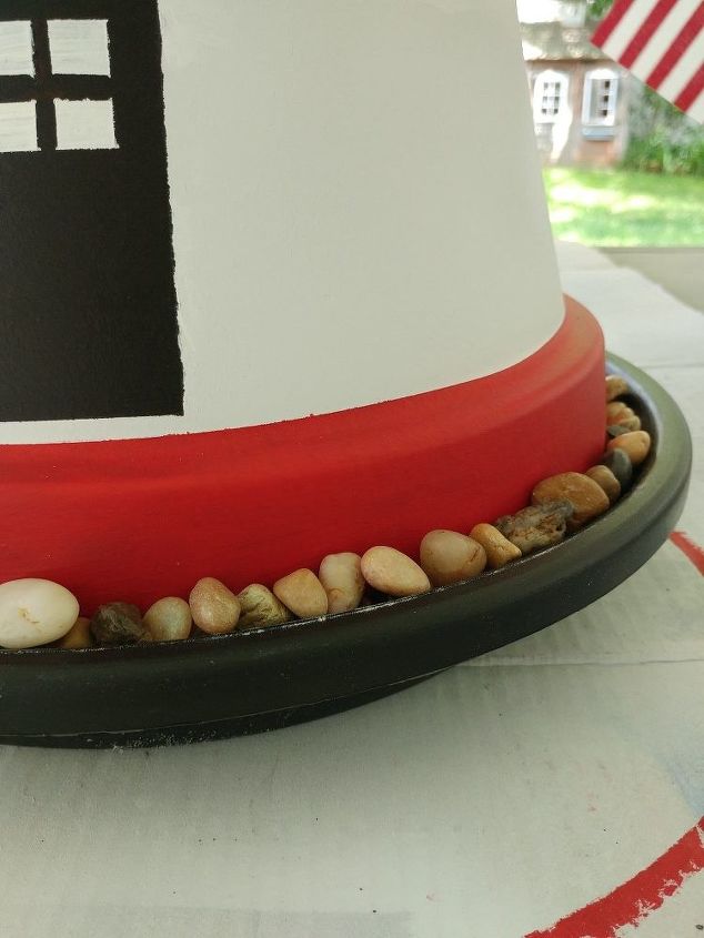 terra cotta pot lighthouse with solar light