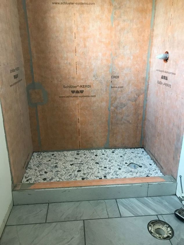 q how do you prevent over grouting pebbles in a shower floor