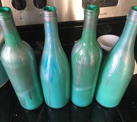 painting clear wine bottles for outdoor sculptures