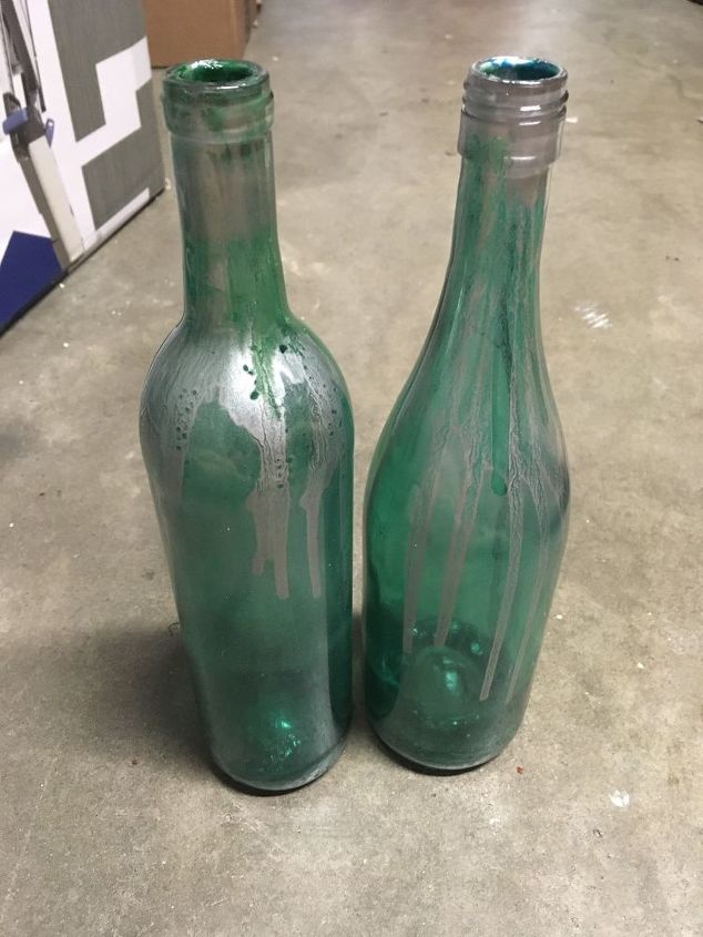 painting clear wine bottles for outdoor sculptures