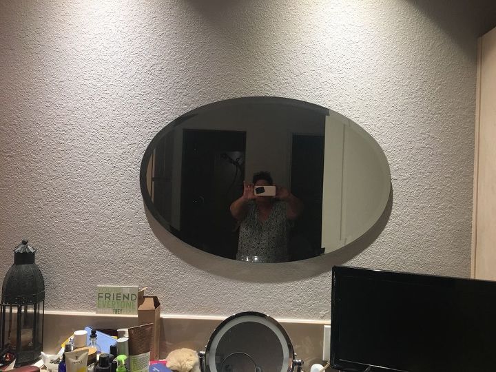 i need an idea to frame my oval shaped bathroom mirrors