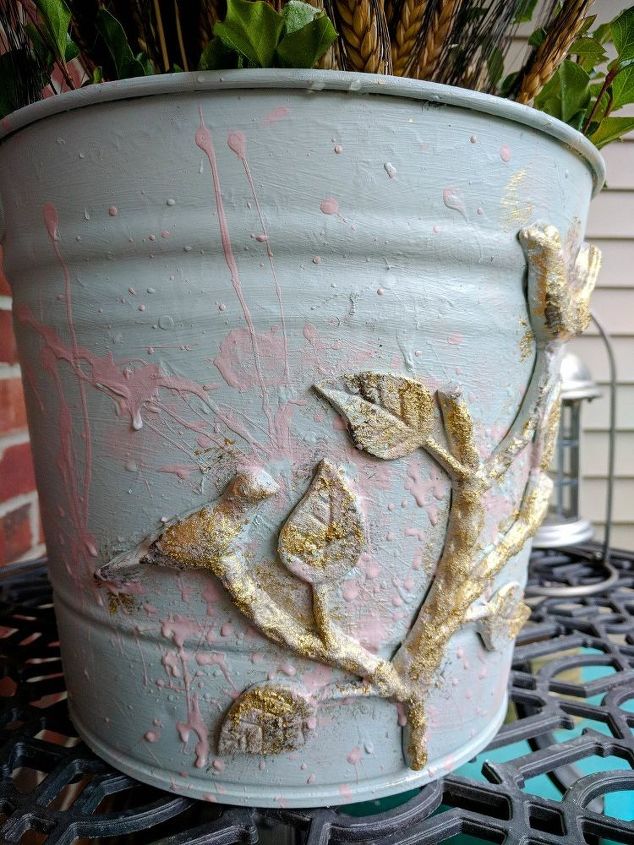 old metal bucket repurposed into charming farmhouse decor
