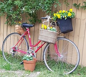 red bicycle planted up as garden art