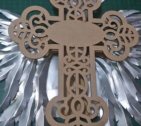 wooden cross with aluminum can wings