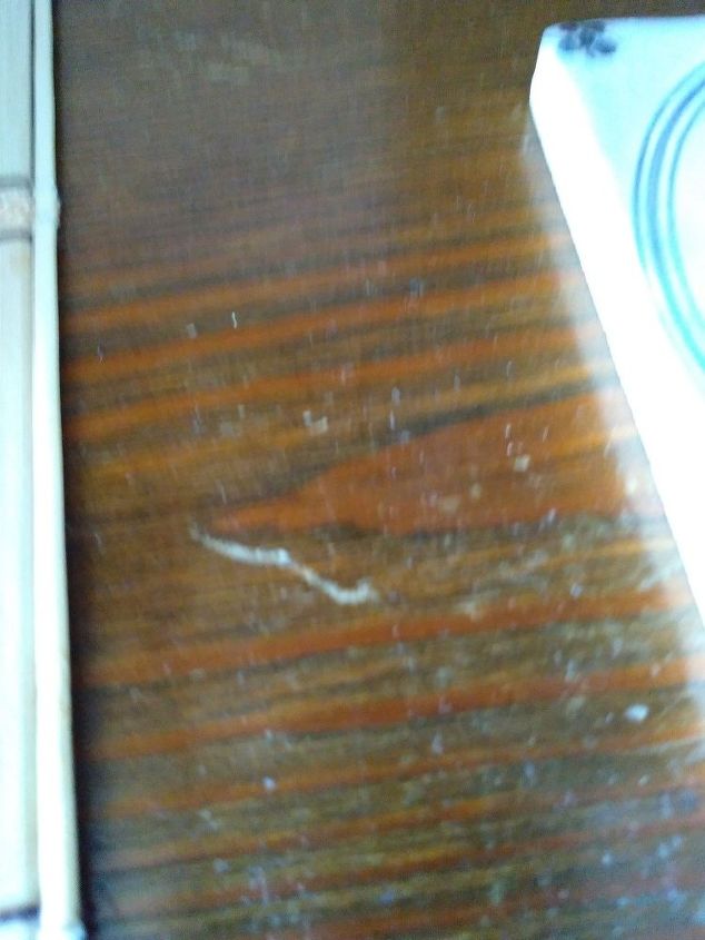 q how to remove scratch on wood