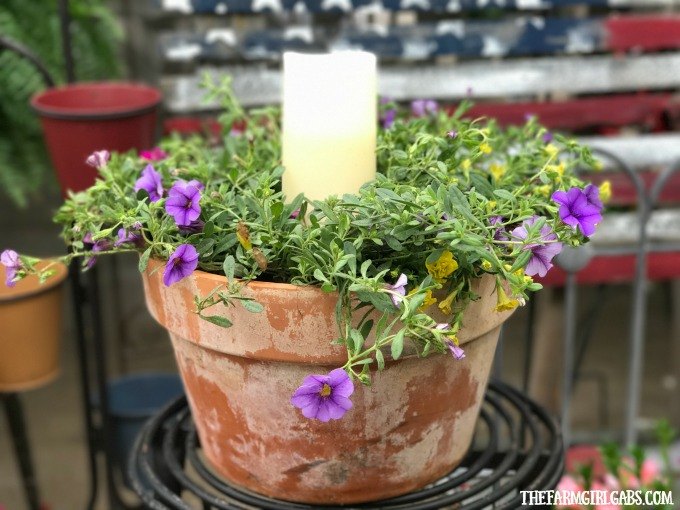 s check out these adorable container garden ideas to copy this spring, Terra Cotta Candle Planter