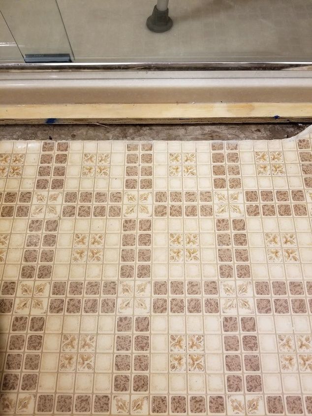 q how do i fill the gap between new shower and old flooring