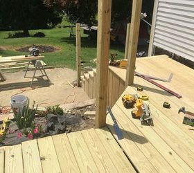 q when putting in a new wooden deck when do you stain it