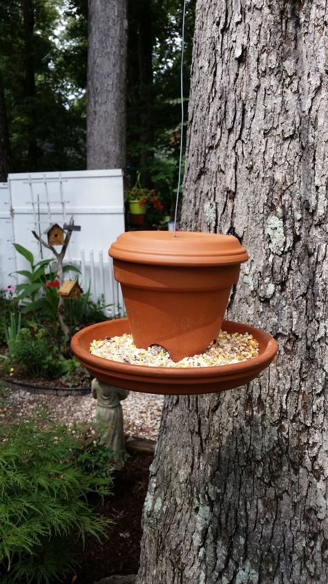 s 18 adorable bird feeders you ll want to make right now, Use a clay pot and saucer