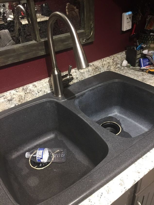 q how do you get white calcium stains off a gray corian sink