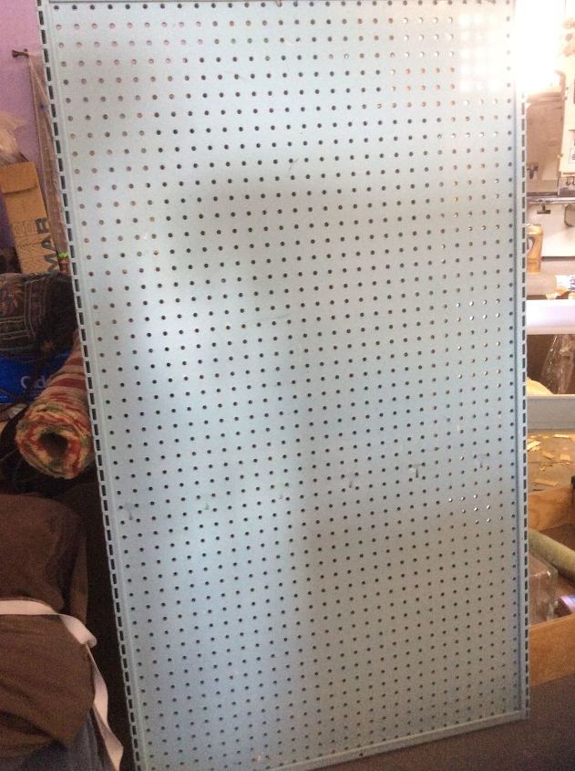 q attaching retail style pegboard shelves to the wall