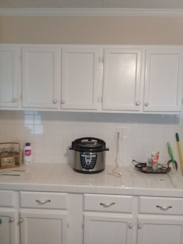 q what can i do to all white square tiles on counter tops and all backpl