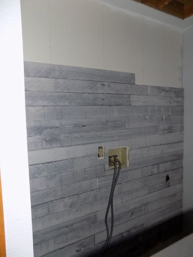 weathered wood plank wall laundry room