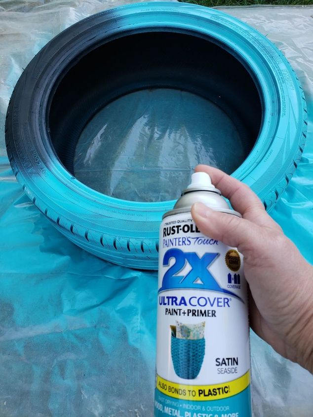 how to make a cute diy tire swing planter for your garden gnomes, Painting the tire blue