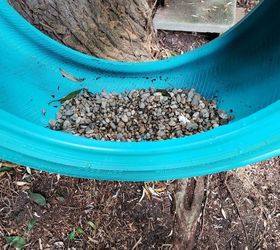 how to make a cute diy tire swing planter for your garden gnomes, Adding gravel to the tire