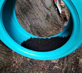 how to make a cute diy tire swing planter for your garden gnomes, Adding dirt to the tire