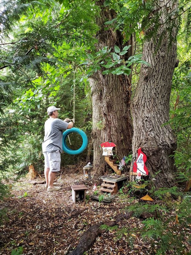 how to make a cute diy tire swing planter for your garden gnomes, Tying the tire swing to the tree