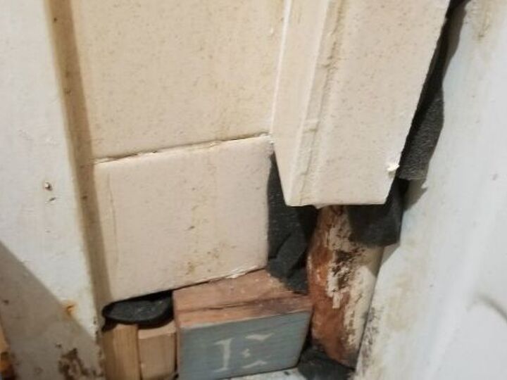 q how can i repair these tiles qirhout demolishing the whole shower wal