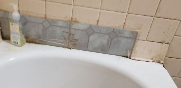 q how can i repair these tiles qirhout demolishing the whole shower wal