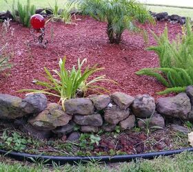 q how do i get rid of weeds in a flowerbed that i want to put rocks in
