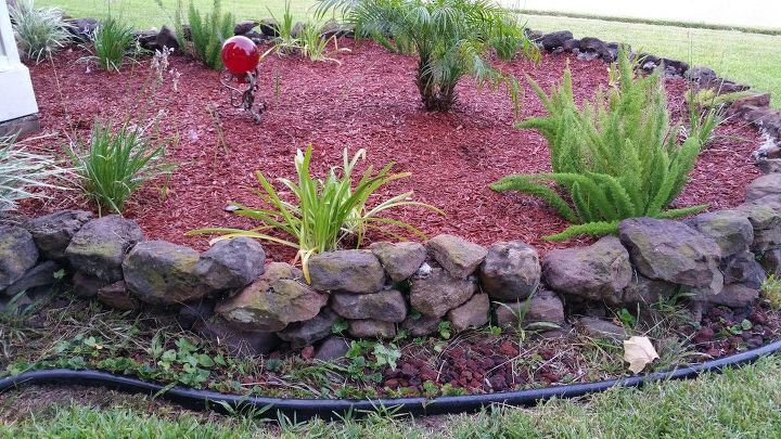 q how do i get rid of weeds in a flowerbed that i want to put rocks in
