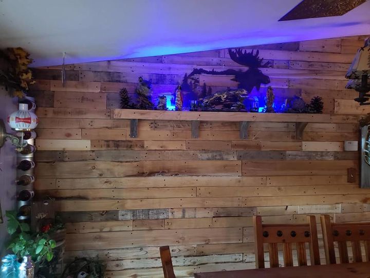 dining area wall clad in reclaimed lumber for less the 10 00