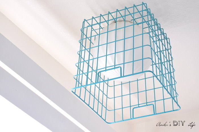 16 brilliant wire basket hacks everyone s doing right now, Update A Light Fixture With A Colorful Basket