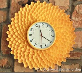 22 diy wall clocks you ll love, Chrysanthemum Clock From Plastic Spoons